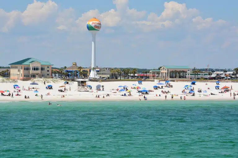 Beach goers at Pensacola Beach in Escambia County, Florida on th